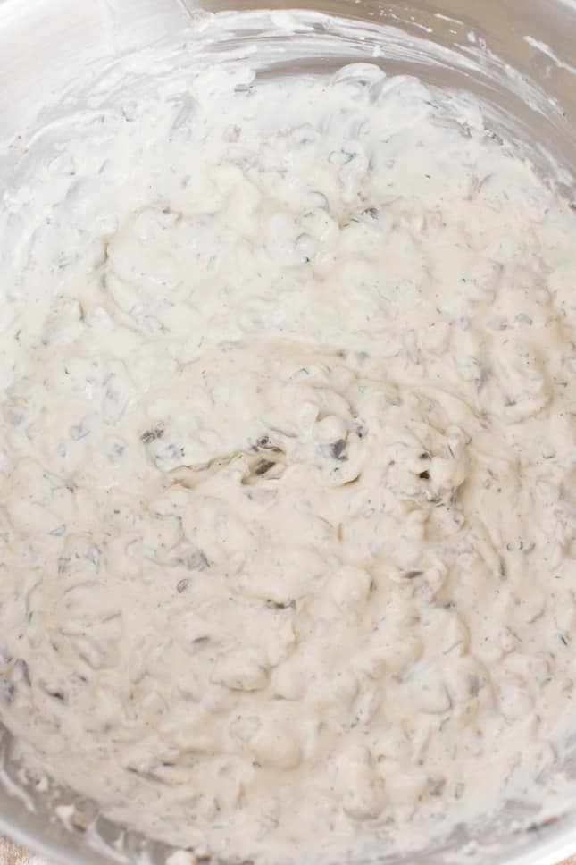 mushrooms added to cream cheese mixture in a mixing bowl