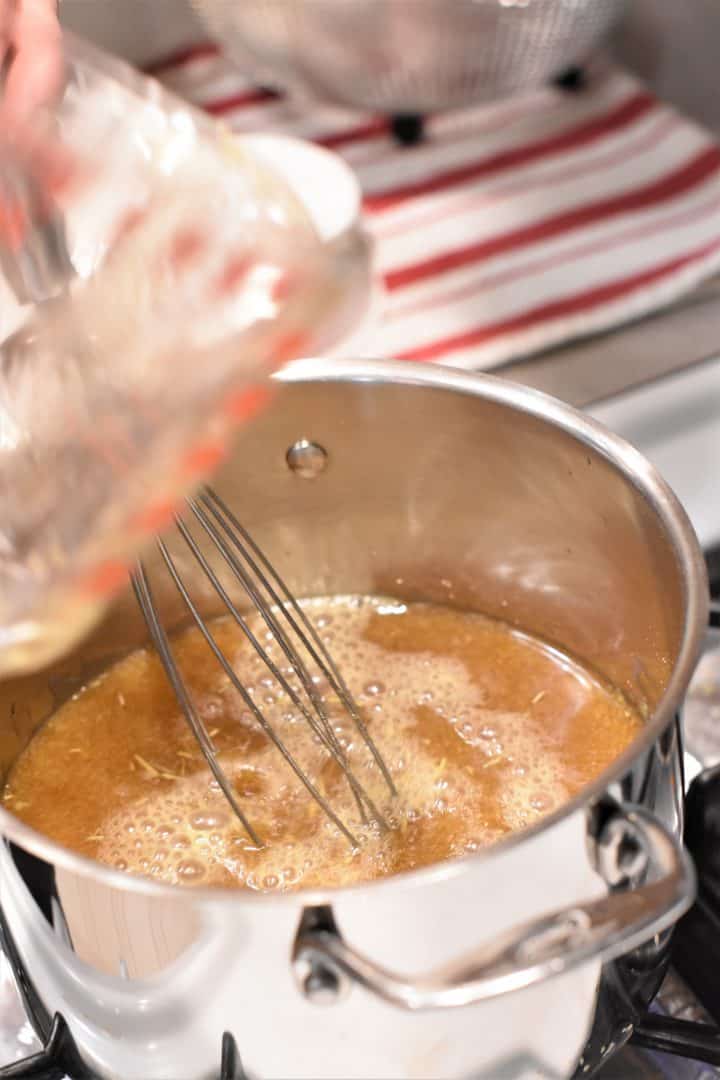 whisking in the vegetable broth