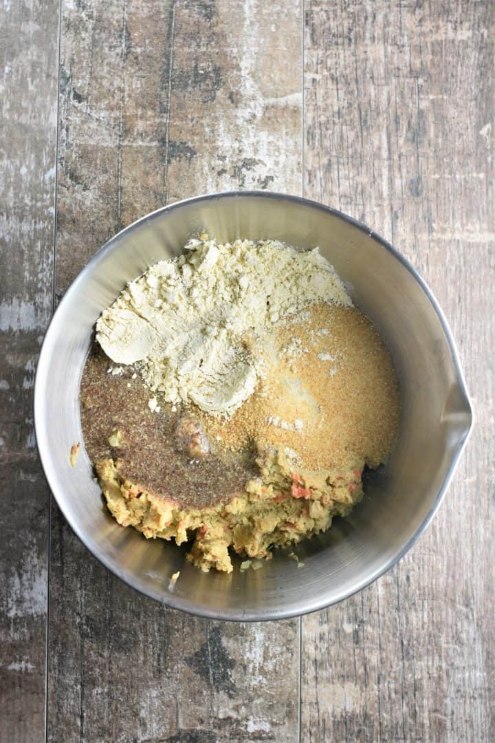 Chickpea loaf mixture with bread crumbs, flax eggs and chickpea flour in a mixing bowl