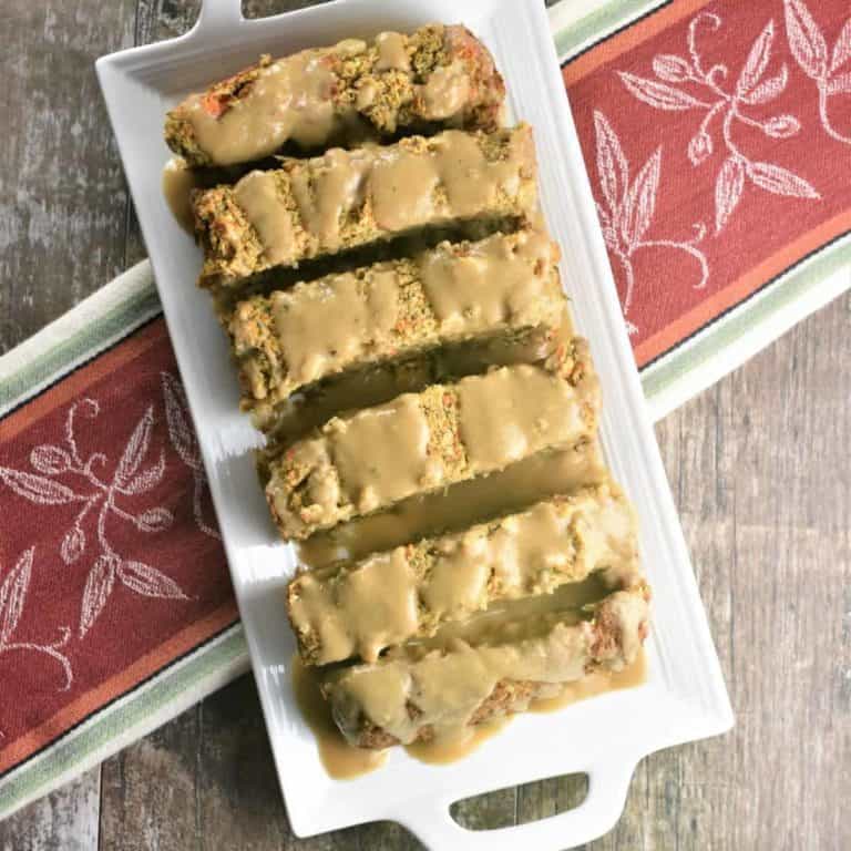 Overhead of sliced chickpea bread on a white plate