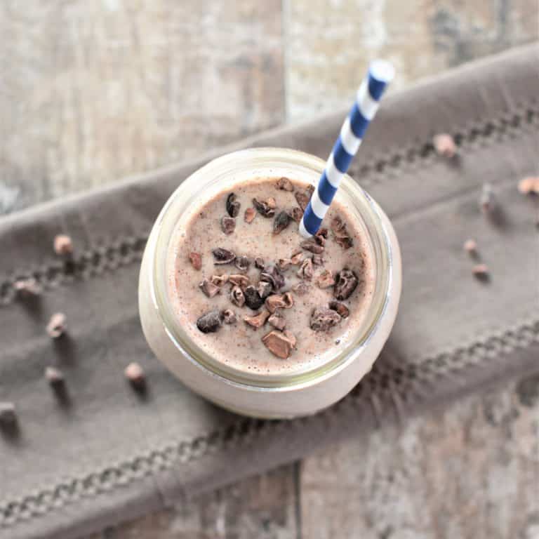 overhead of smoothie with straw in it
