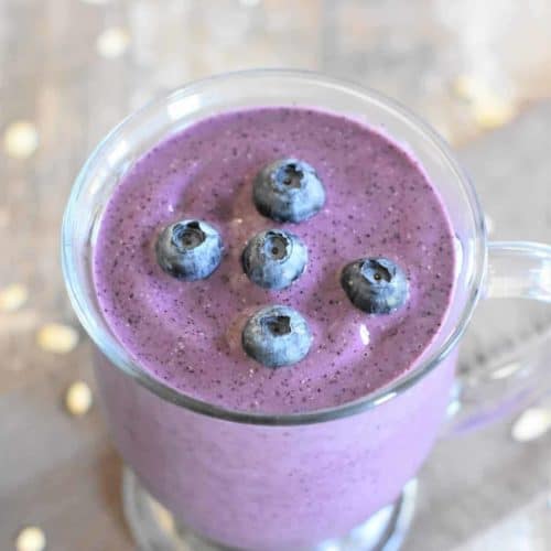 slight overhead of smoothie with blueberries on top