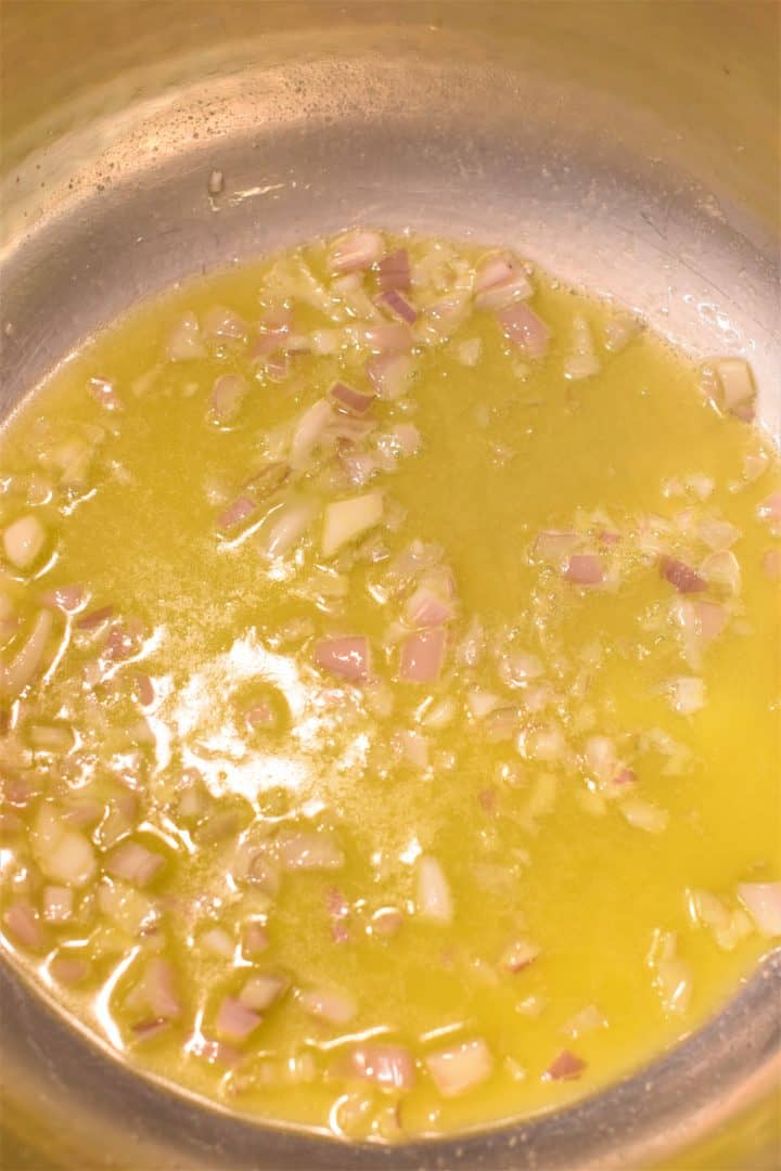 Shallot cooking in butter and olive oil in a pan