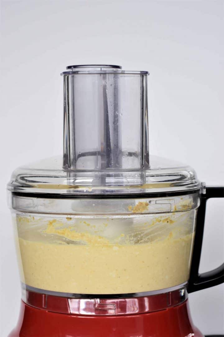 Ingredients for quiche in a food processor blended together
