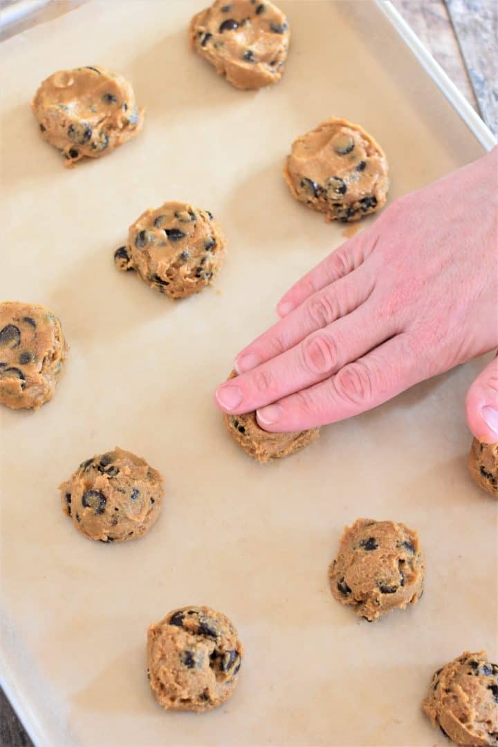Pressing down cookie dough with fingers
