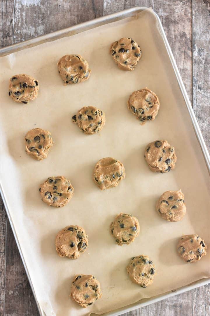 Cookie dough on parchment on baking sheet ready for oven