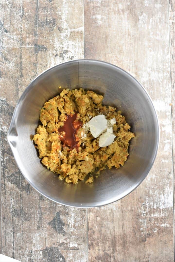 Chickpea mixture with Buffalo Sauce and chickpea flour in a bowl