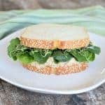front view of chickpea salad on a sandwich with lettuce and microgreens