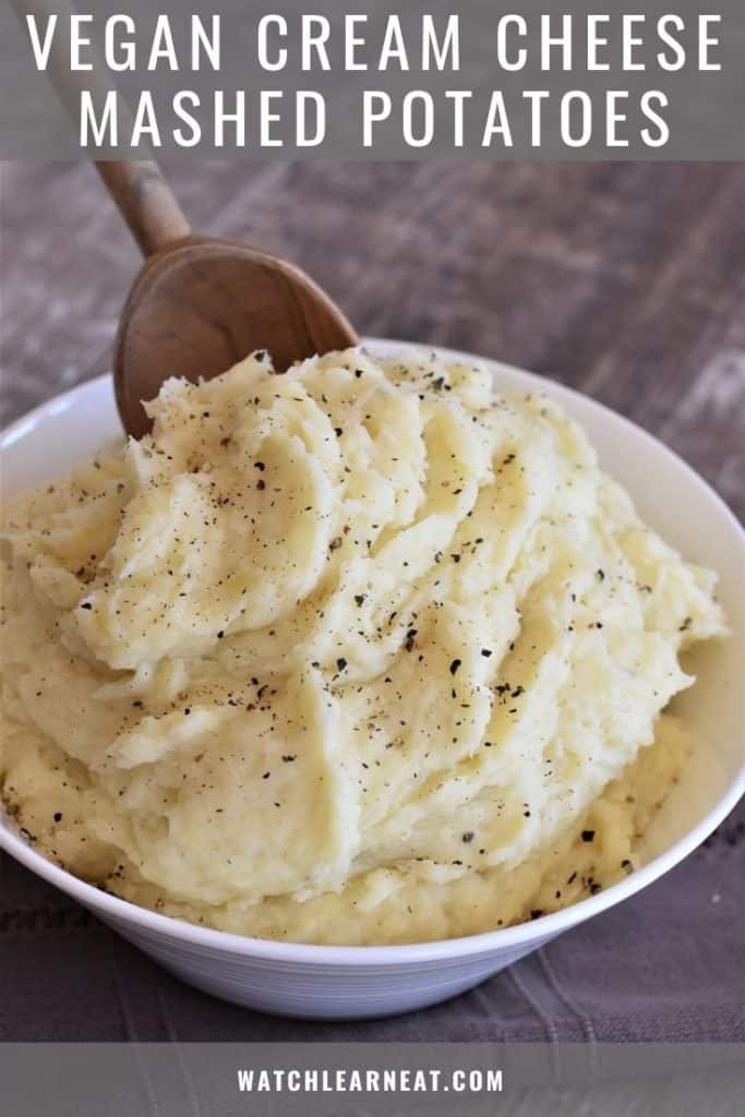 pin showing wooden spoon in bowl of mashed potatoes
