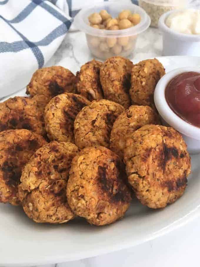 Chickpea nuggets on a plate with a side of ketchup