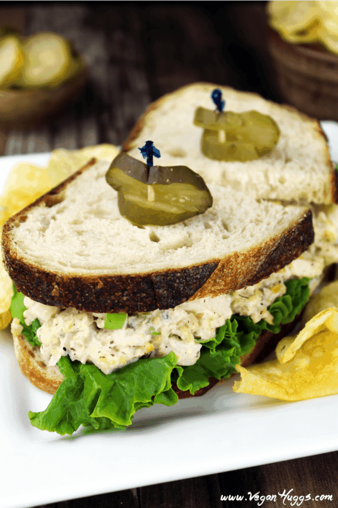 vegan tuna salad sandwich on a plate with potato chips
