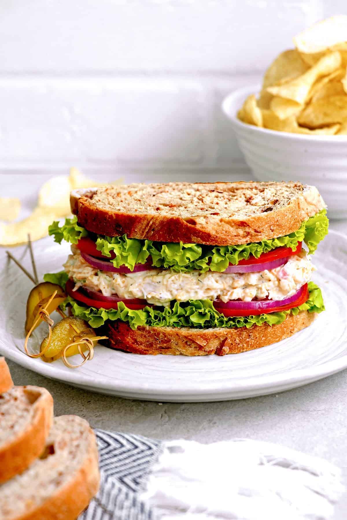 vegan tuna salad sandwich on a white plate. plate