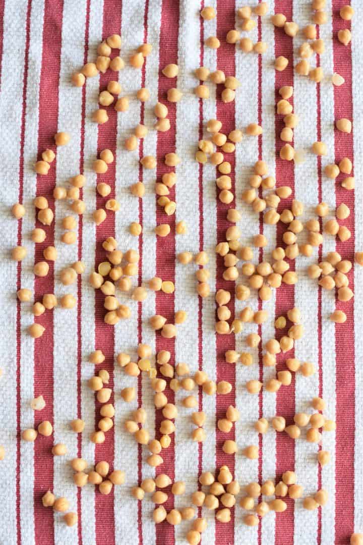 Chickpeas spread out on a kitchen towel