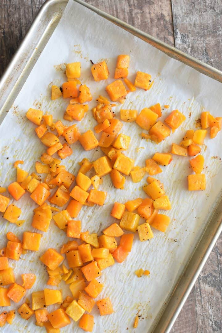 Cooked butternut squash on baking sheet
