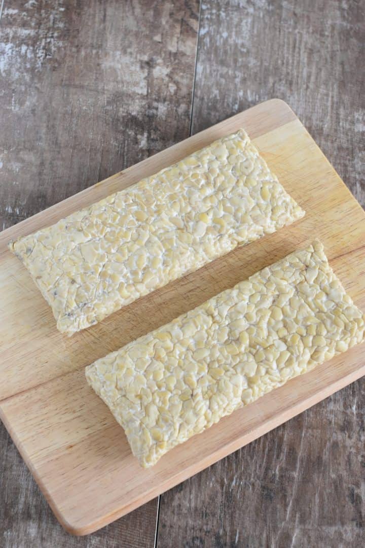 two blocks of tempeh on a cutting board