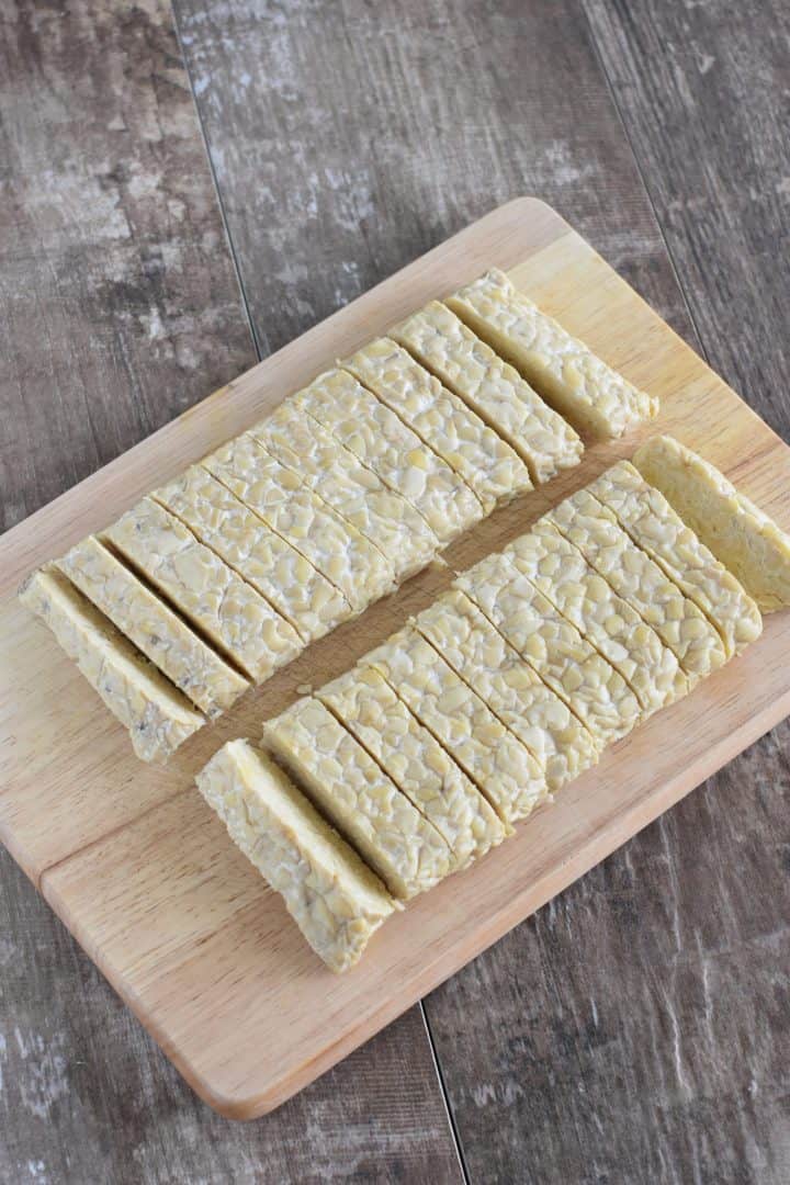 tempeh cut into strips on the cutting board