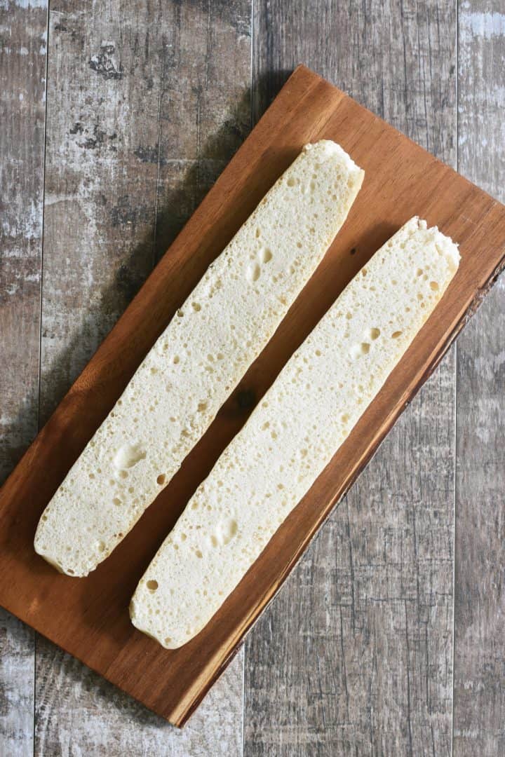 Gluten-Free baguette sliced horizontally on cutting board