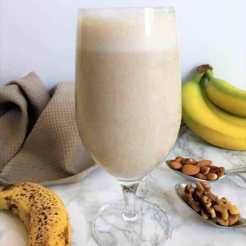 front view of banana nut smoothie in a glass.