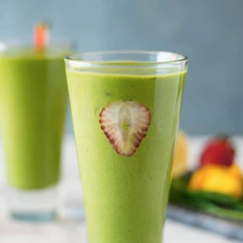 front view of green detox smoothie in a tall glass.