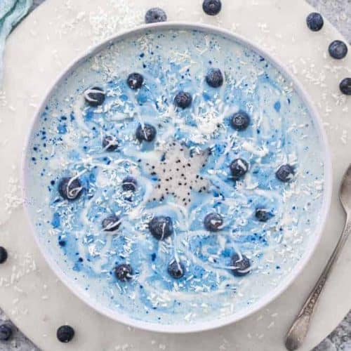 overhead of frozen inspired smoothie bowl with blueberries.