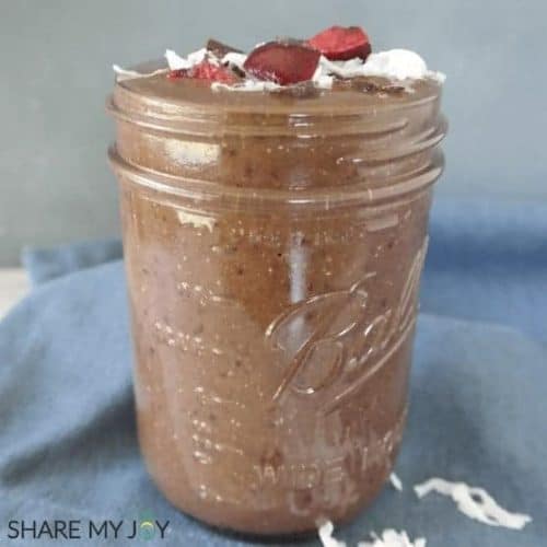 front view of black forest smoothie in a mason jar.