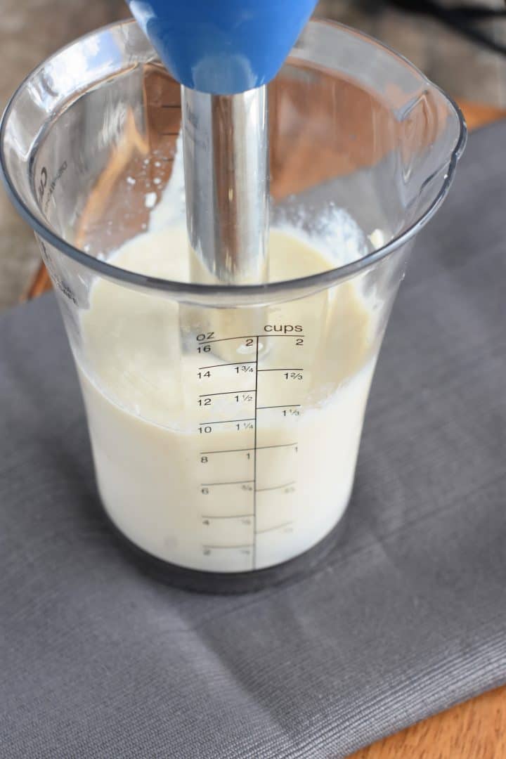 Blending the mayo ingredients with an immersion blender