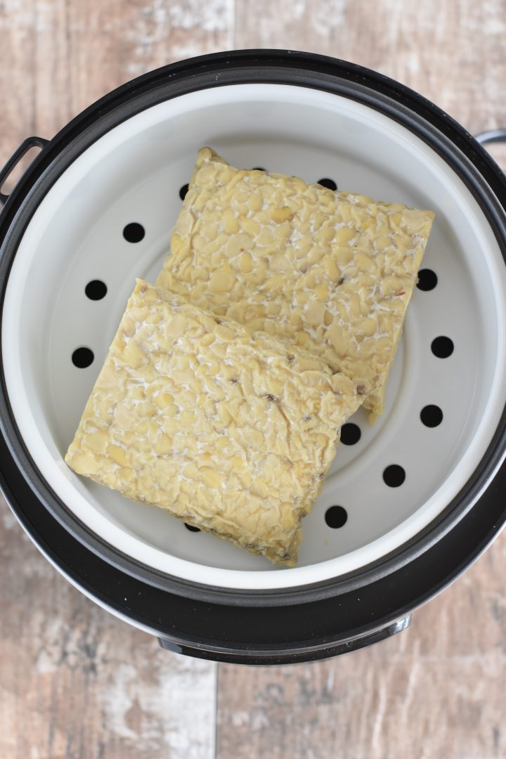 Tempeh in steamer basket of rice cooker