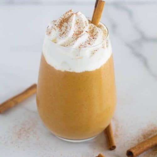 kekto pumpkin smoothie with a cinnamon stick in it.