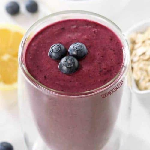 paleo blueberry pie smoothie with blueberries on top.