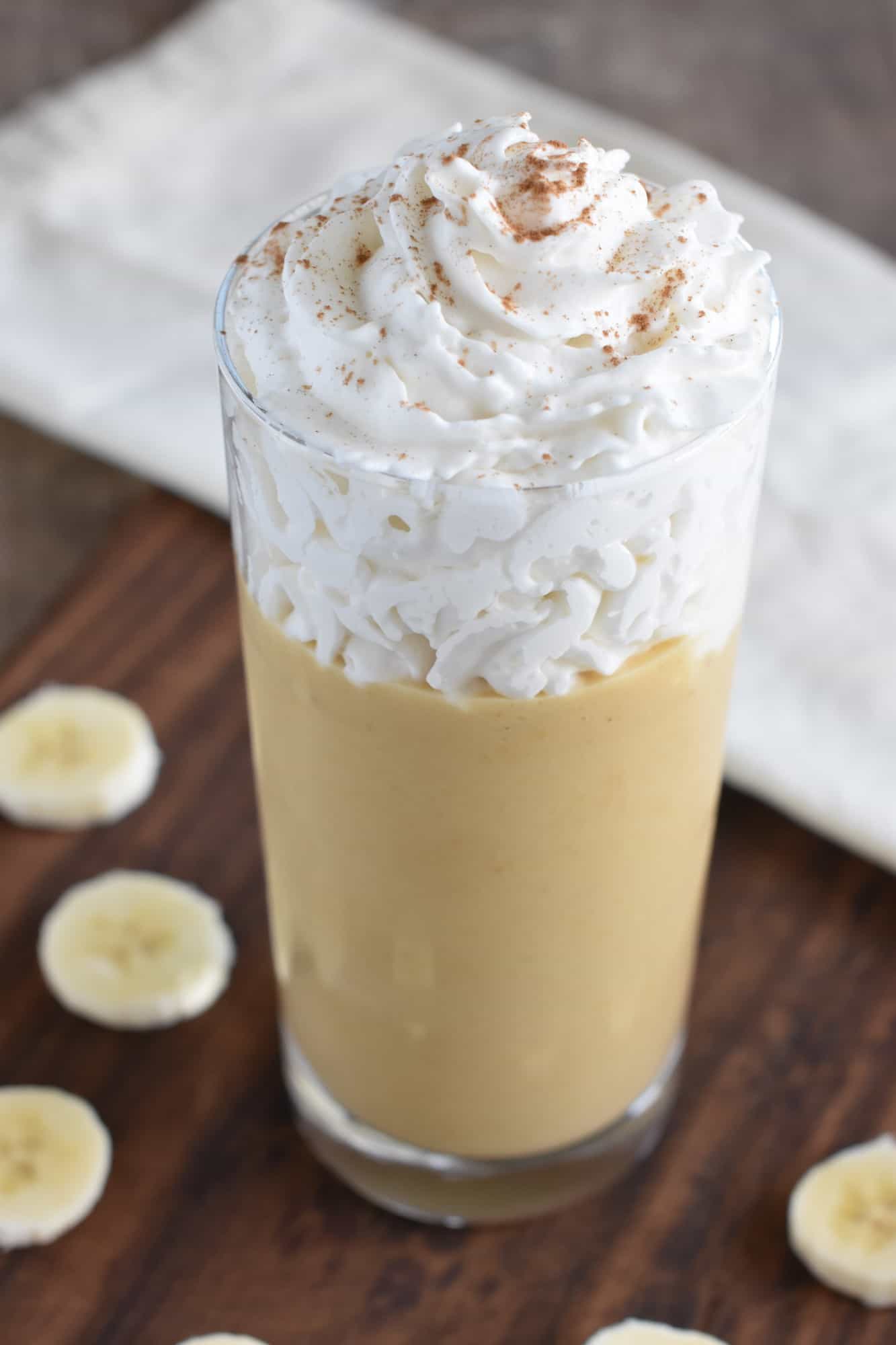 smoothie topped with non-dairy whip and cinnamon