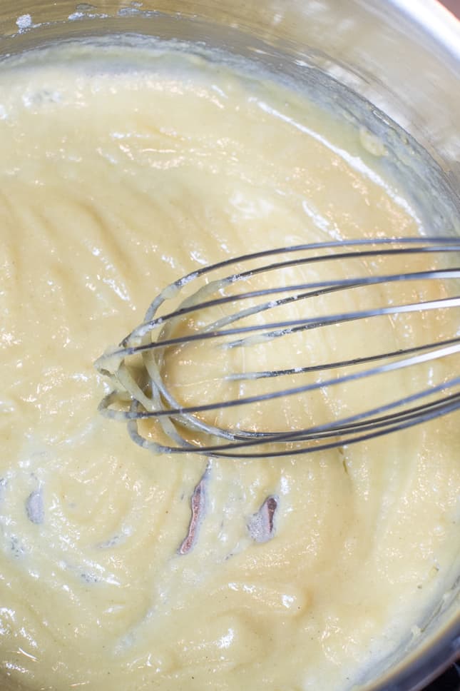 whisking the flour and butter together to make a roux
