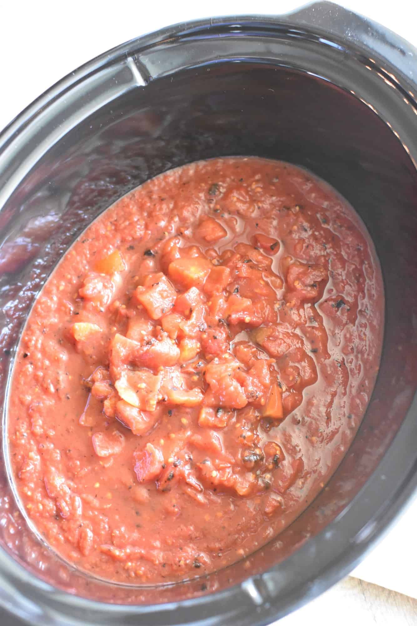 tomatoes, maple syrup, lime juice and vegetable broth added to slow cooker