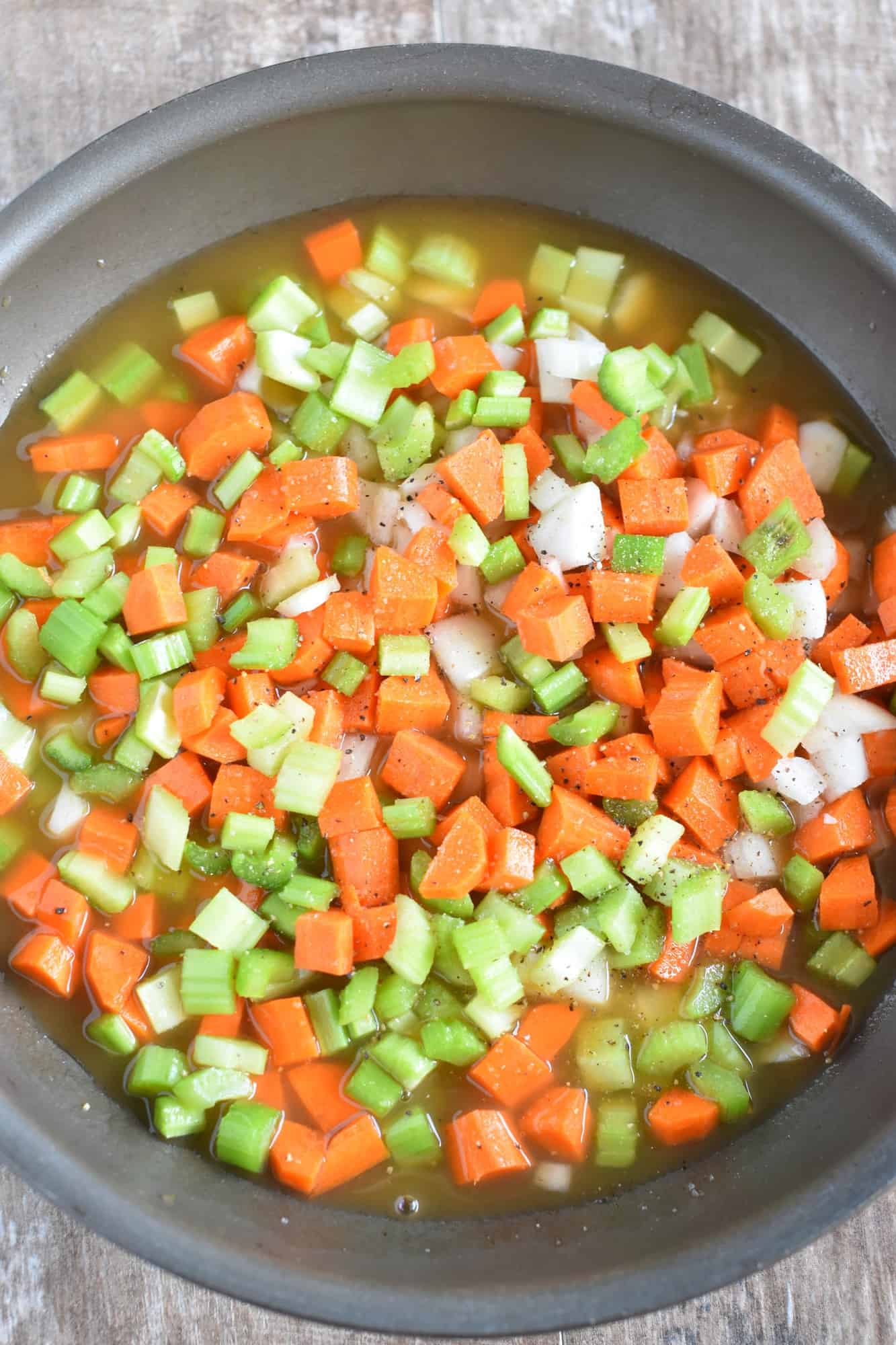 carrots, celery and onion in skillet with vegetable broth.