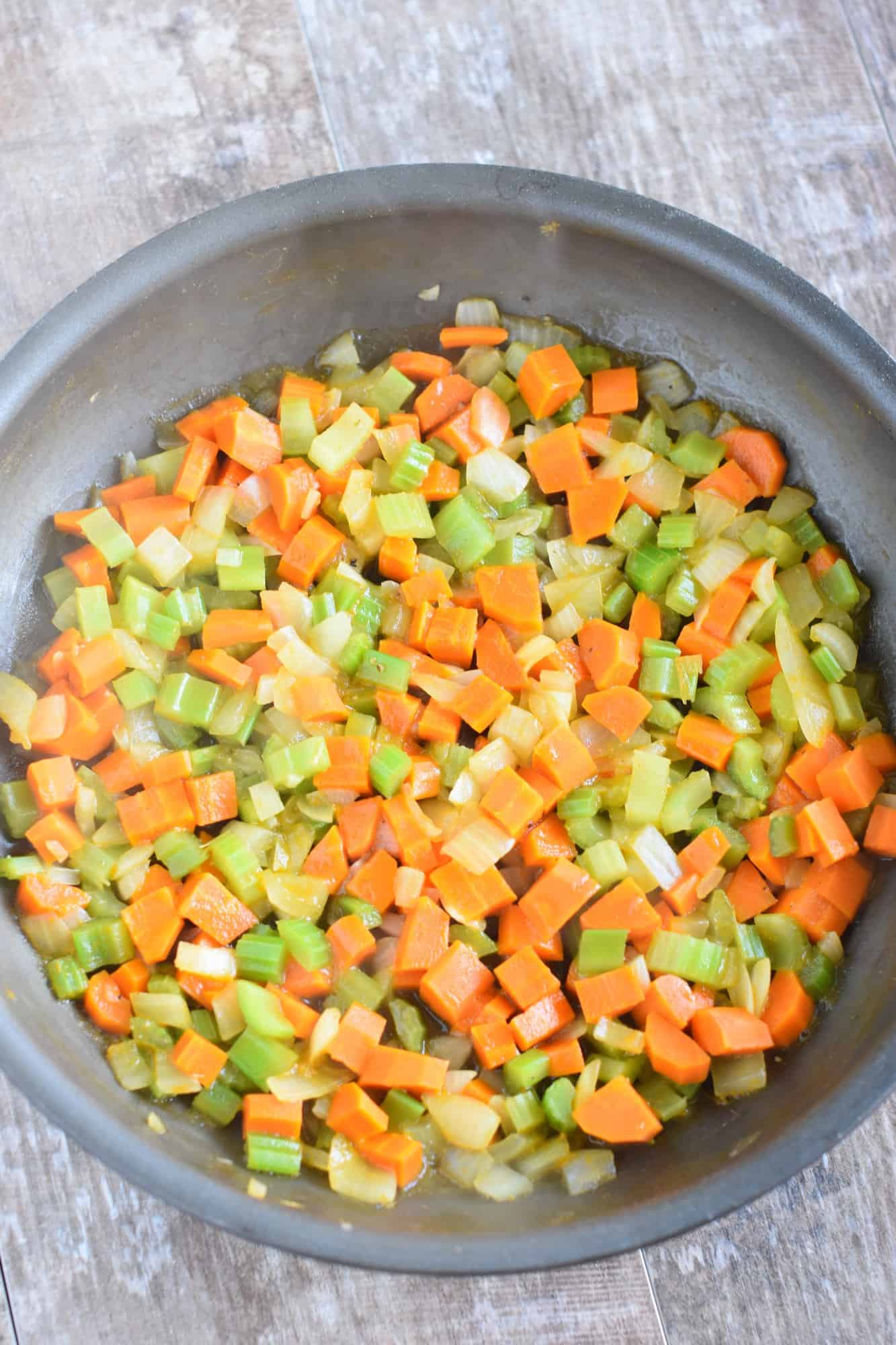 carrots, celery and onion after being sauteed in skillet