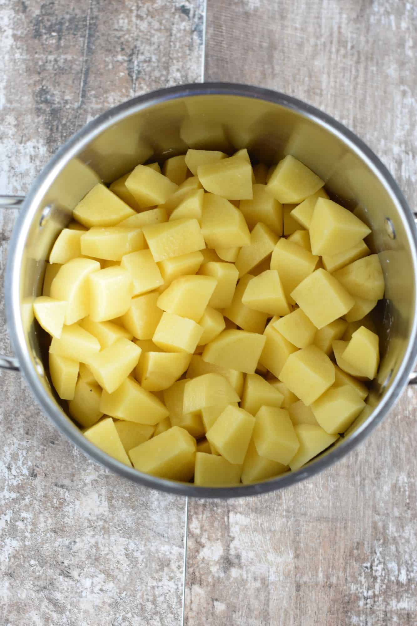 cut potatoes added to a pot