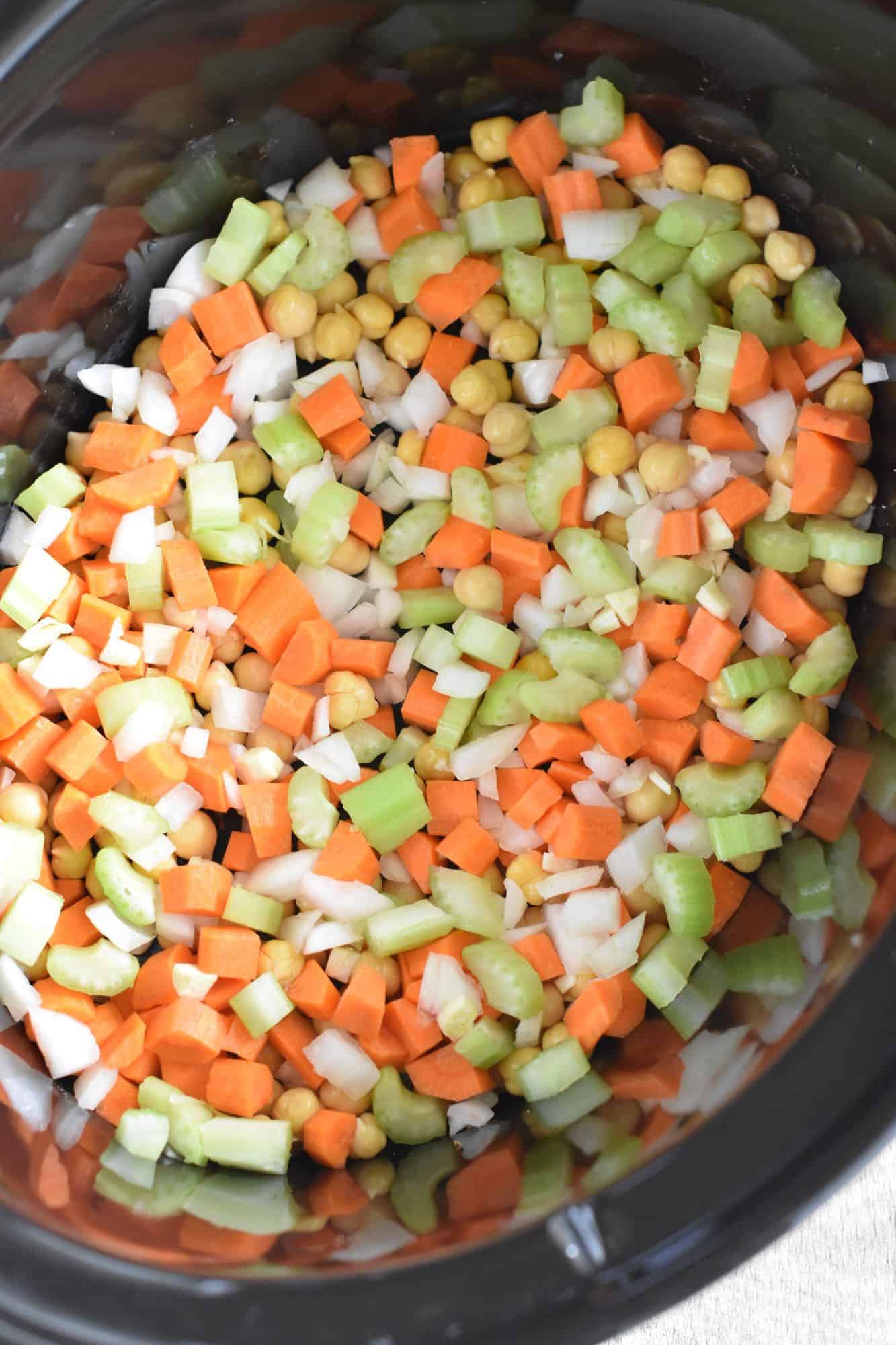 chickpeas, onion, carrots and celery in slow cooker