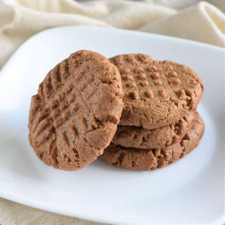 4 cookies on a white plate