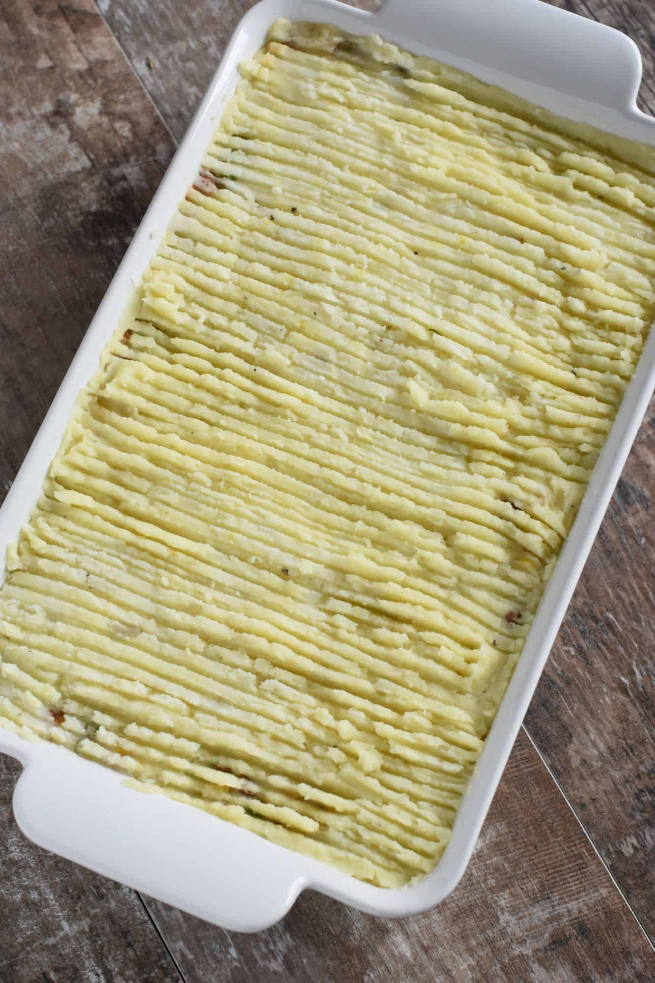 fork ridges in the layer of mashed potatoes