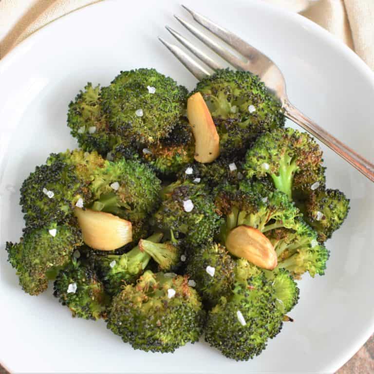 overhead of broccoli garnished with coarse sea salt