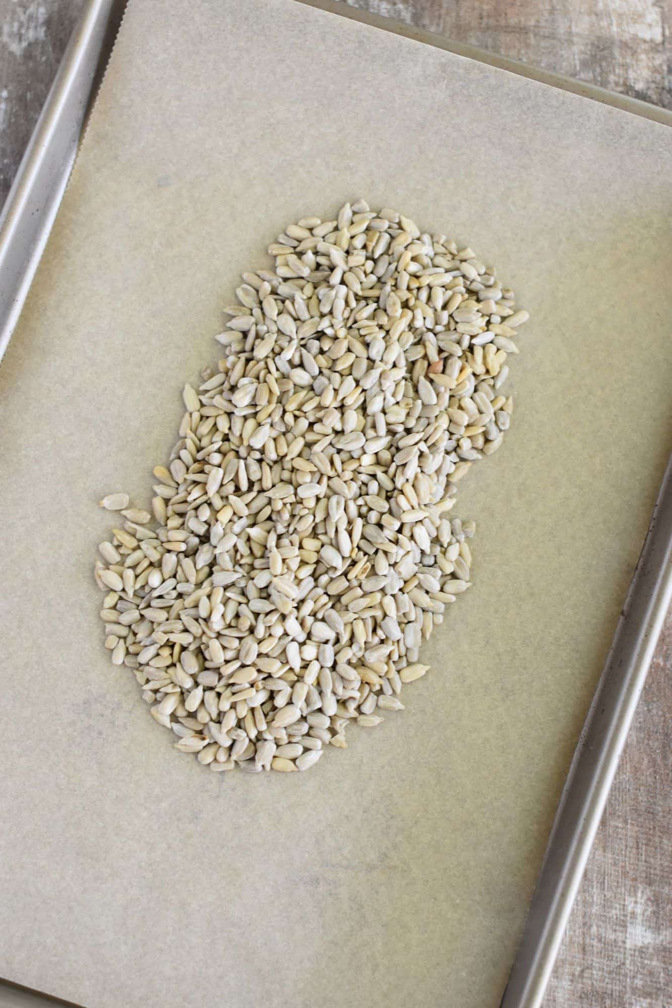 raw kernels in pile in middle of baking sheet