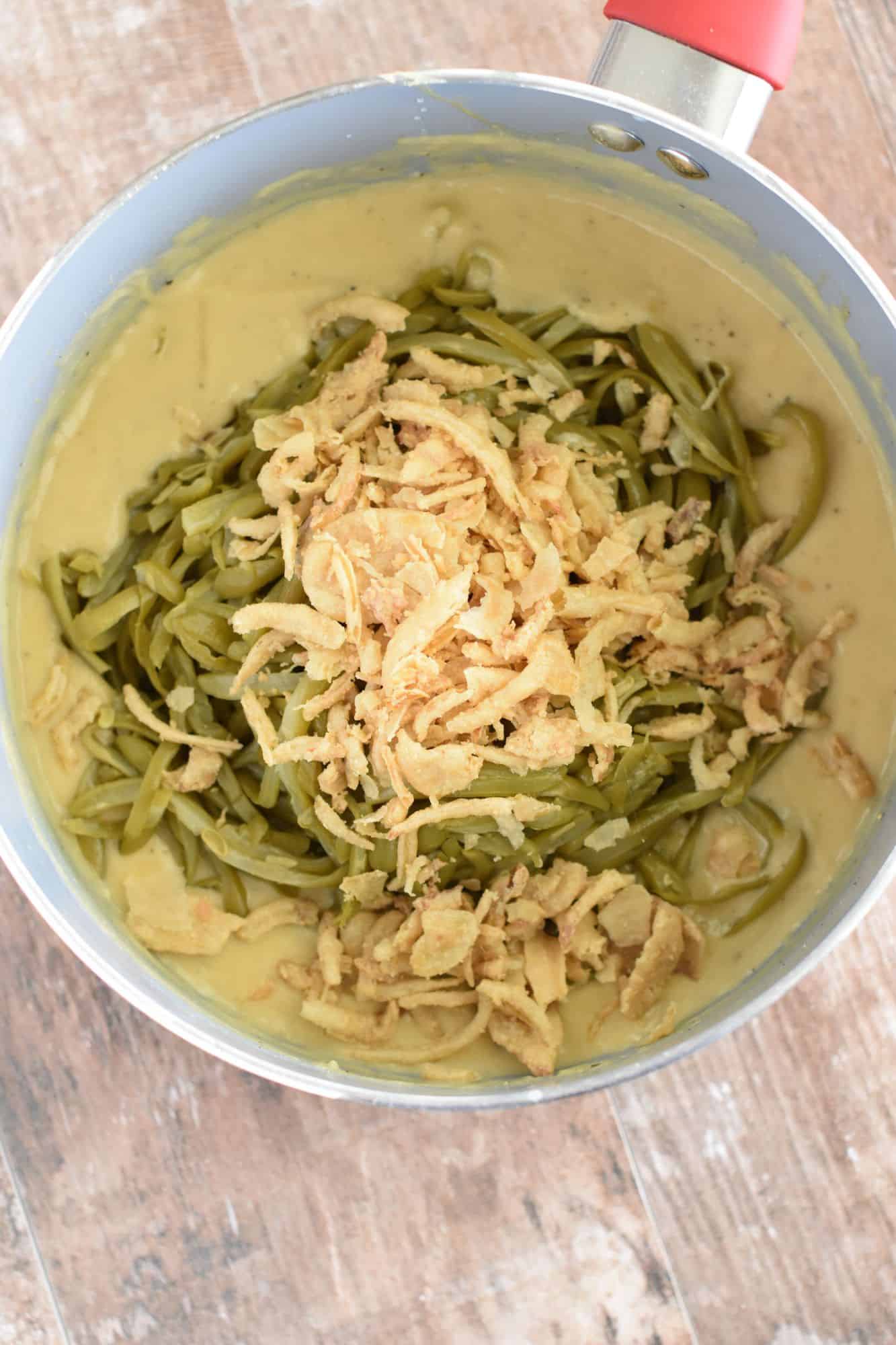 green beans and crispy onions added to saucepan