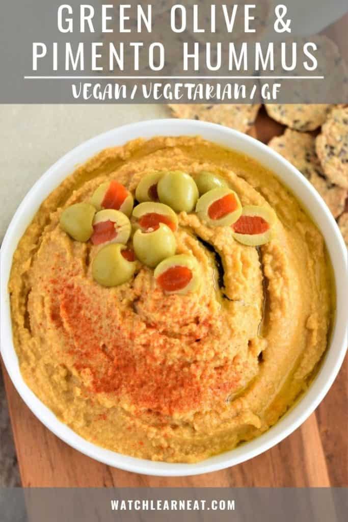 pin showing overhead shot of hummus in white bowl on wooden board