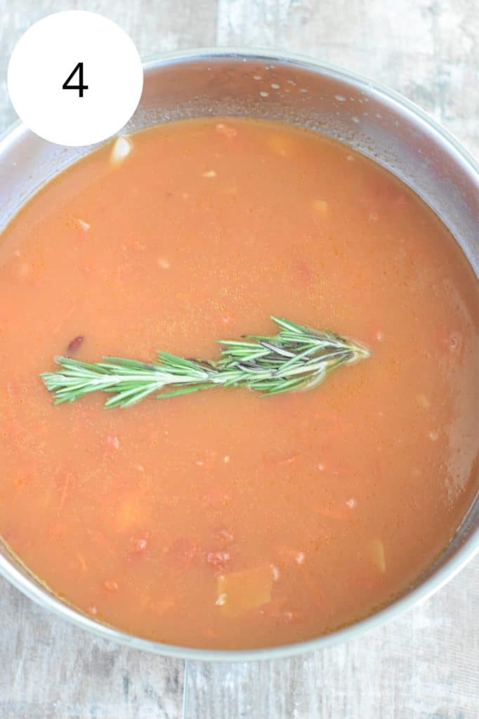 sprig of rosemary added to the soup
