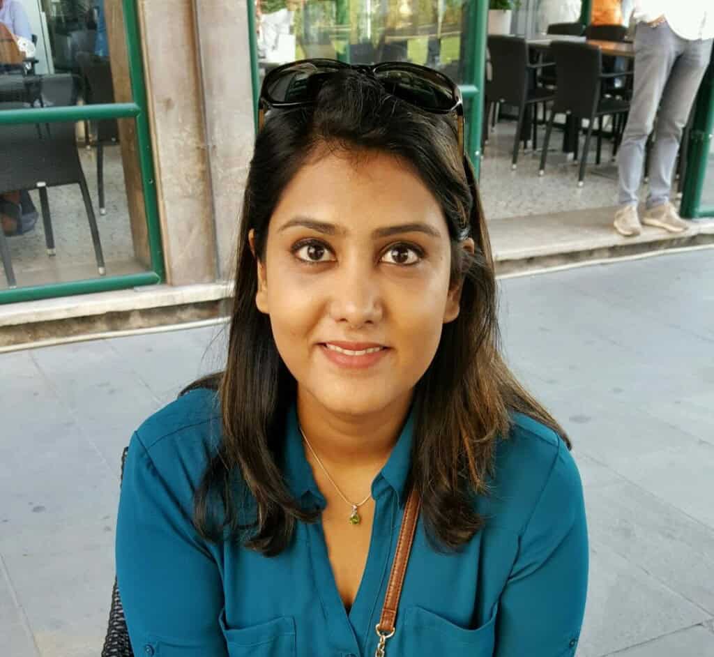 Sireesha with coffee in hand