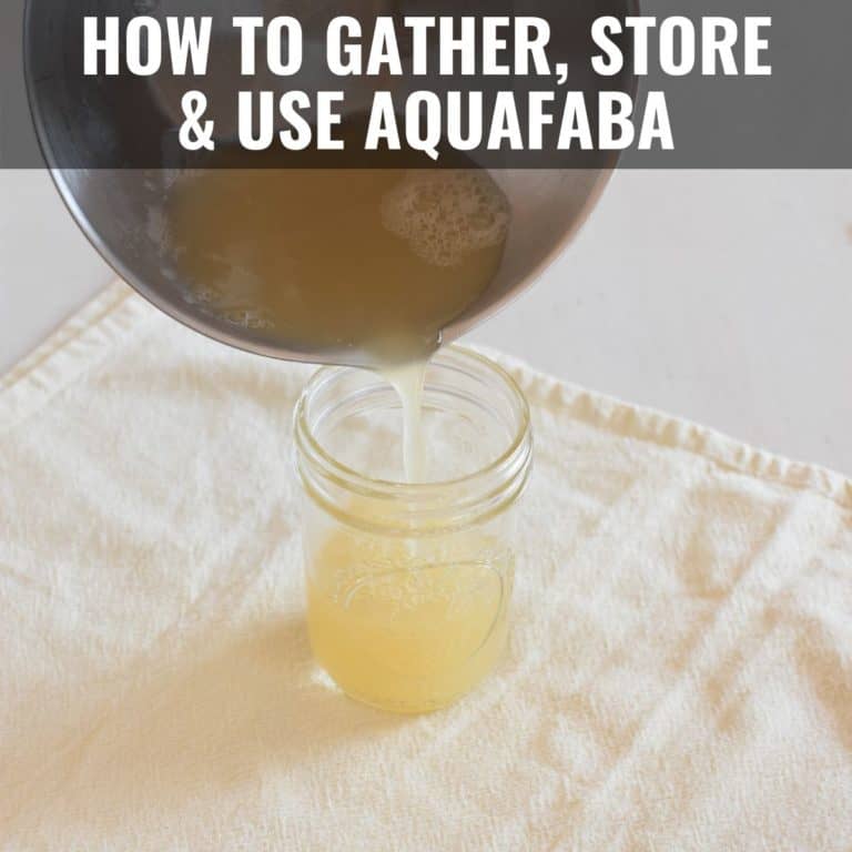 pouring aquafaba into a mason jar from a mixing bowl