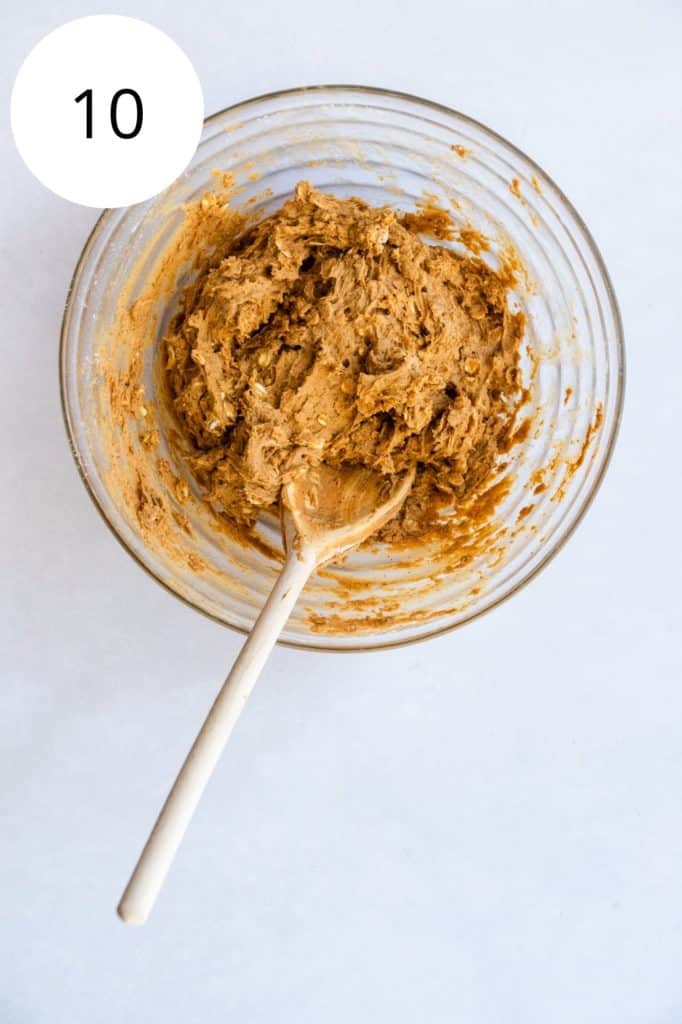 wet and dry ingredients combined in mixing bowl with wooden spoon