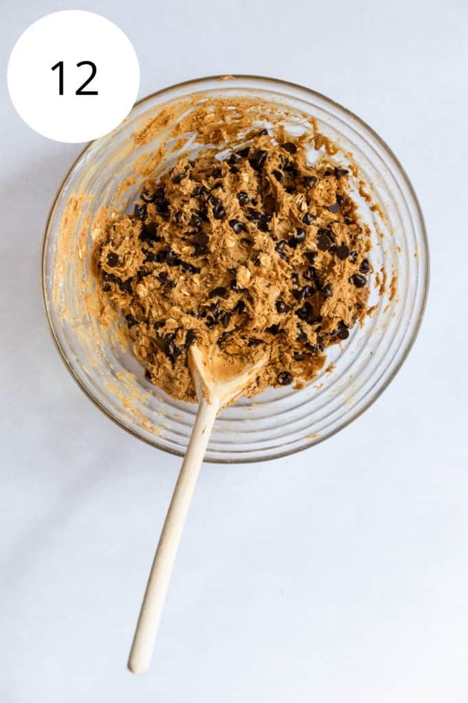 vegan peanut butter oatmeal cookie dough after mixing in mixing bowl with wooden spoon