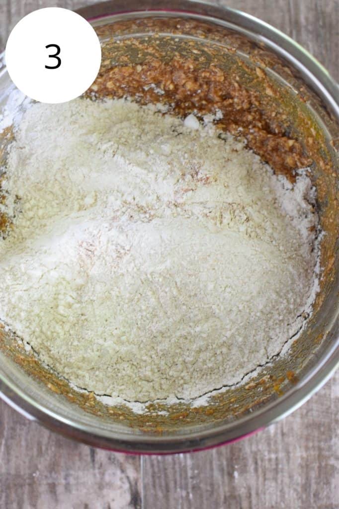 dry ingredients added to wet ingredients in a mixing bowl