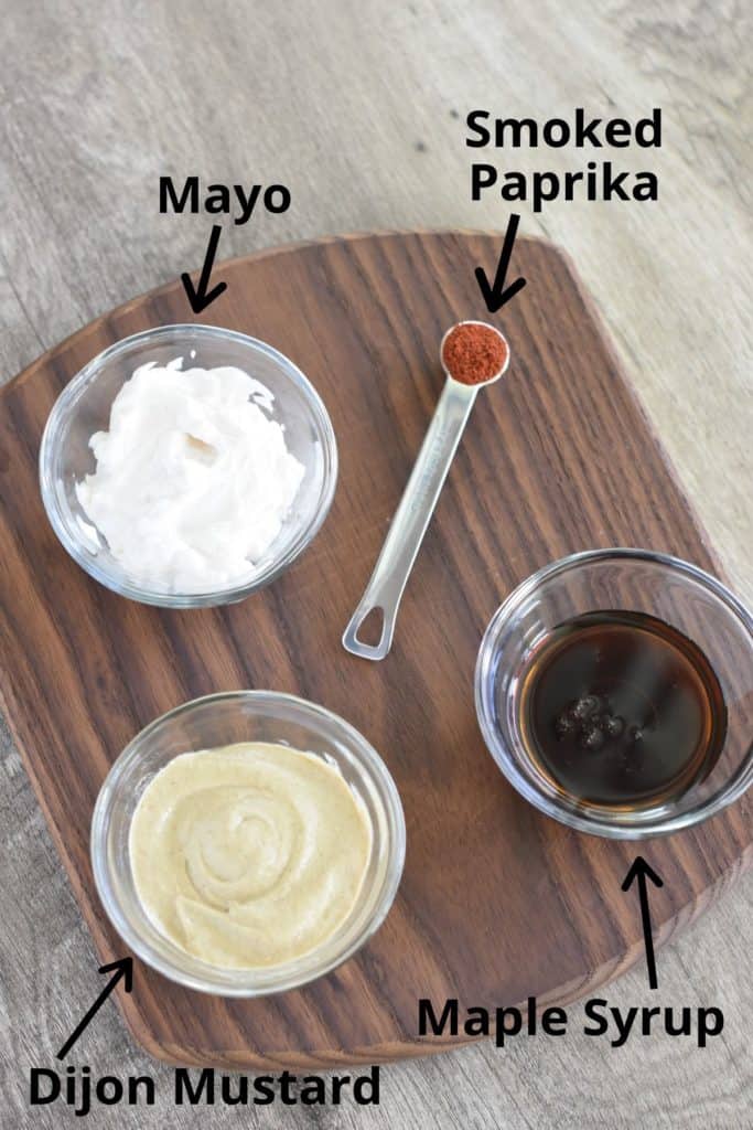 ingredients for dipping sauce on a wooden board with text overlay
