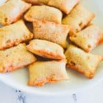 close-up of pizza rolls on white plate